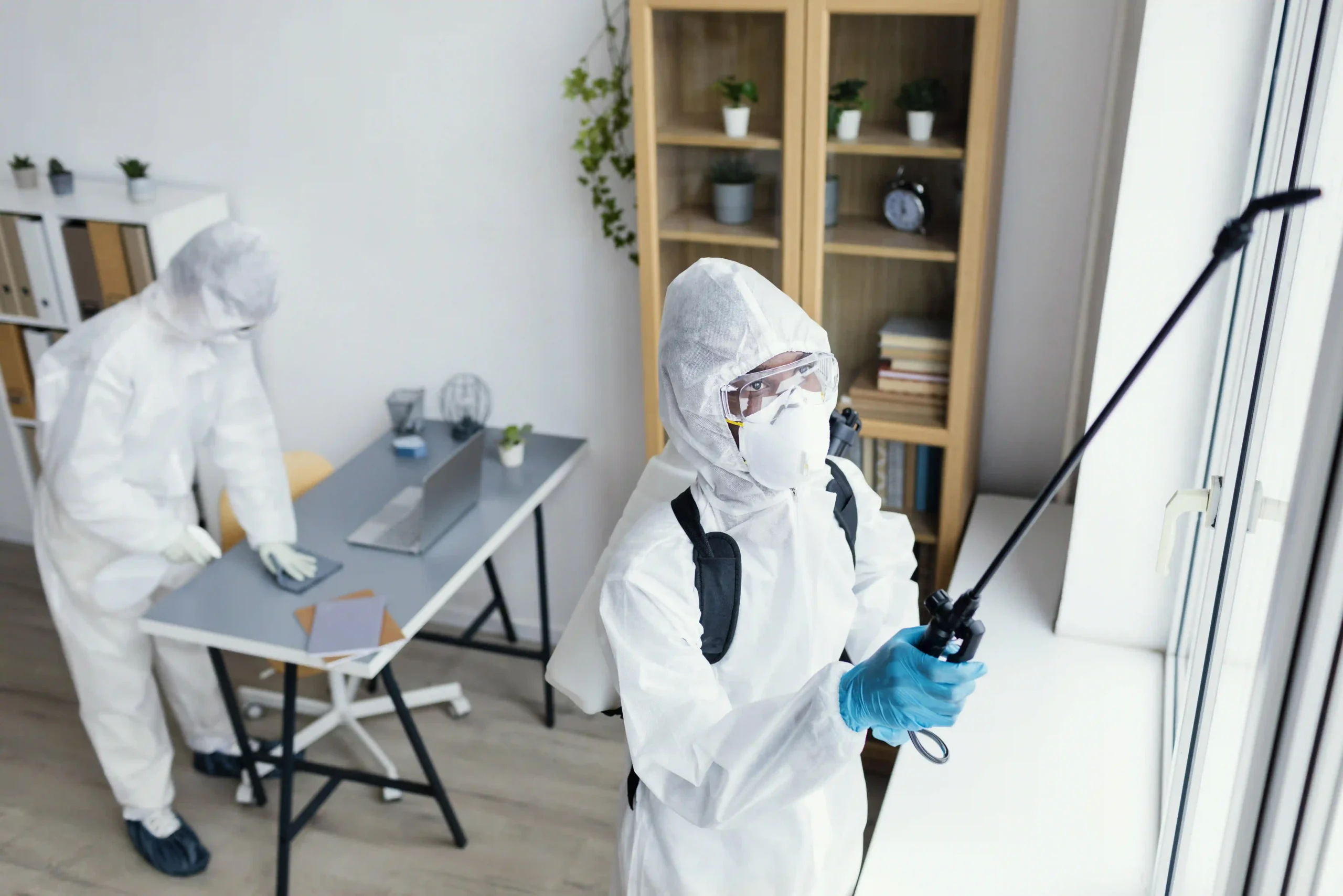 people disinfecting together dangerous area